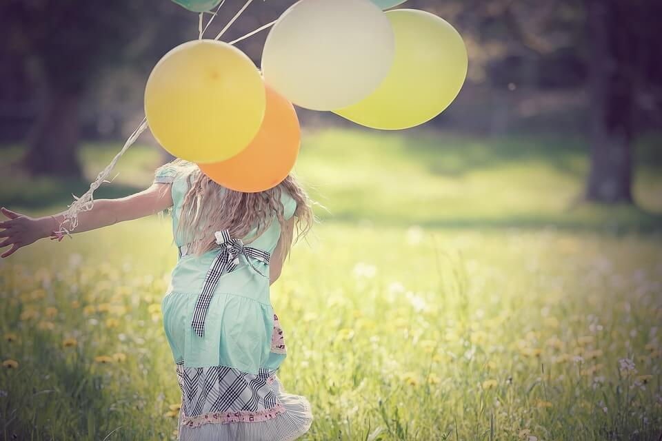 A Girl Playing With Balloon