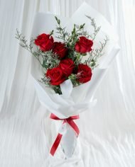 Red rose flower bouquet with red ribbon